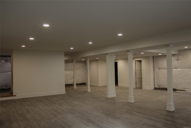 basement with hardwood / wood-style flooring