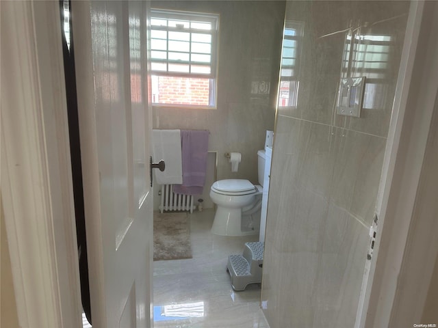 bathroom with tile patterned floors and toilet