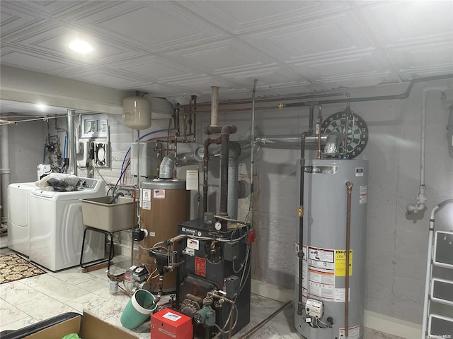 utilities with independent washer and dryer, sink, and water heater