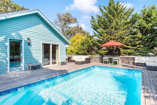 view of pool featuring a wooden deck