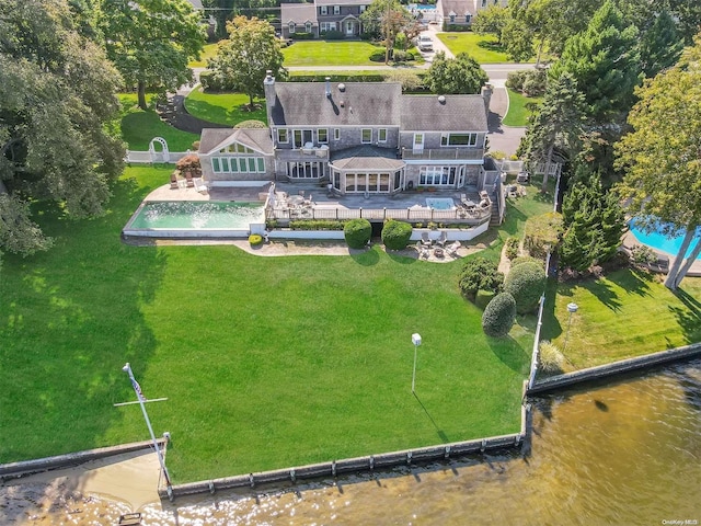 birds eye view of property featuring a water view