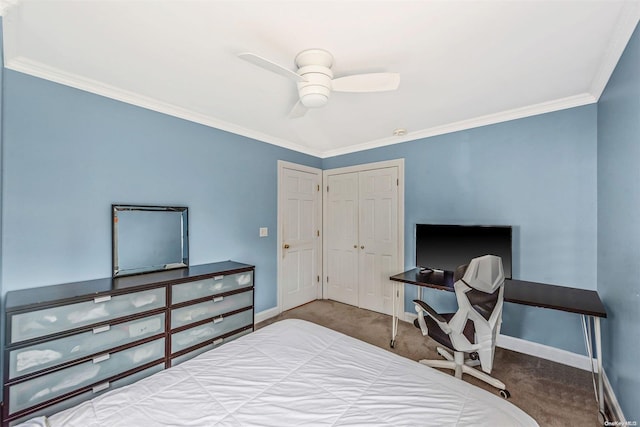 carpeted bedroom with a closet, ceiling fan, and ornamental molding