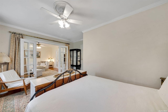 bedroom featuring ceiling fan, ornamental molding, light hardwood / wood-style flooring, and french doors