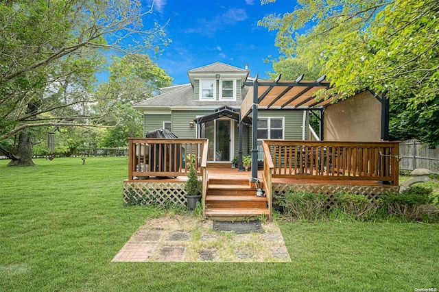 back of house with a deck, a pergola, and a yard