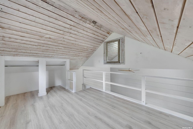 bonus room with light hardwood / wood-style flooring, wood ceiling, and vaulted ceiling