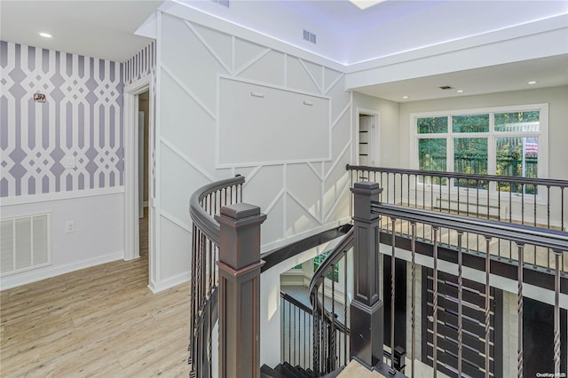 stairs with hardwood / wood-style floors