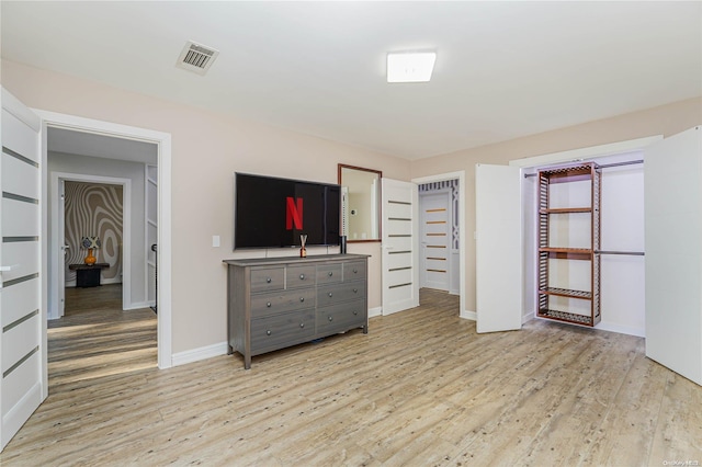 unfurnished bedroom featuring light wood-type flooring