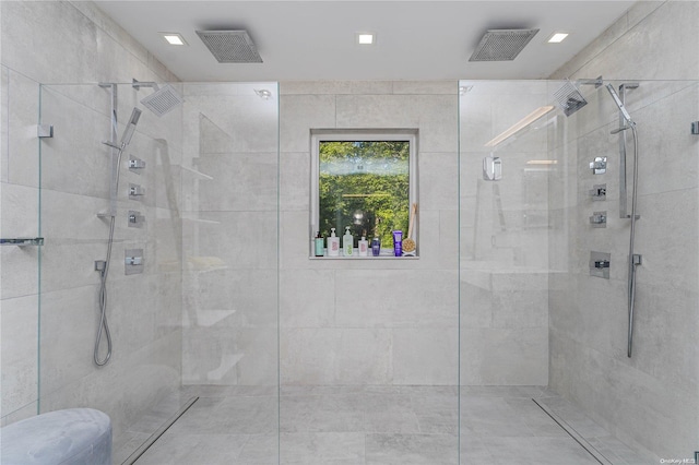 bathroom featuring a shower with door