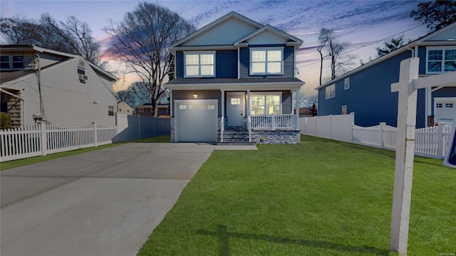 view of front of house featuring concrete driveway, a front lawn, and fence