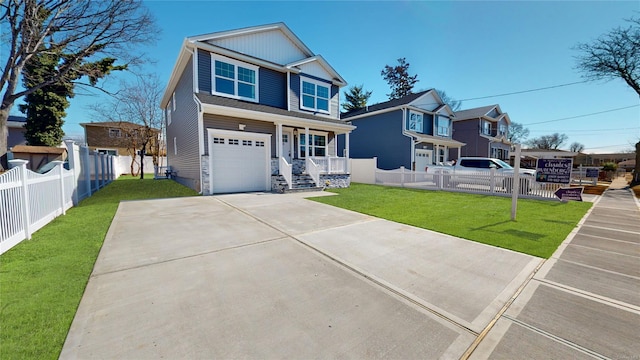 view of front of property featuring a garage, concrete driveway, a front yard, and fence