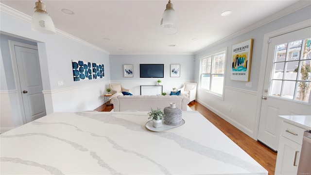 bedroom with light wood-style floors, baseboards, crown molding, and recessed lighting