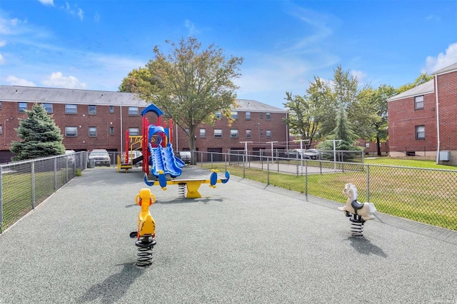 view of play area featuring a lawn