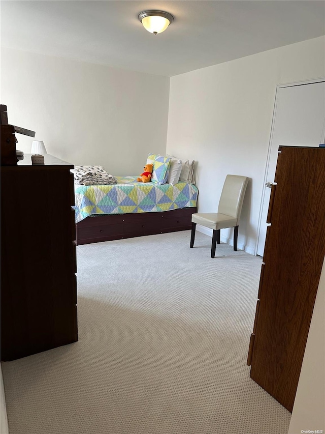 bedroom with light carpet