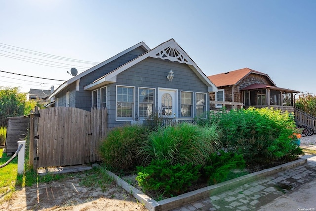 view of front of house with a sunroom