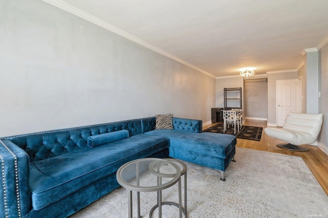 living room featuring hardwood / wood-style floors and ornamental molding