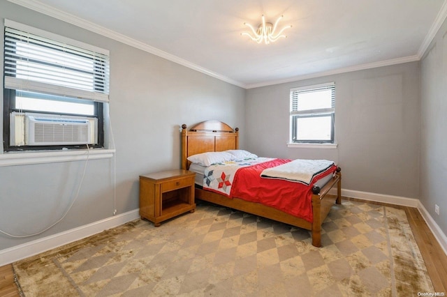 bedroom featuring cooling unit, light hardwood / wood-style floors, and crown molding