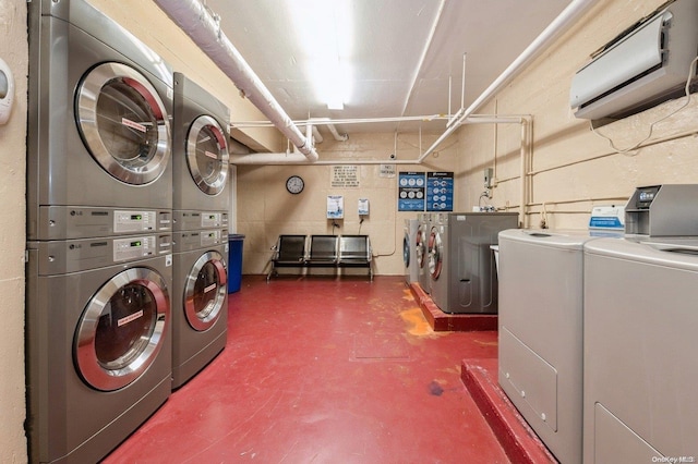 laundry room with independent washer and dryer, stacked washer / dryer, and a wall mounted AC