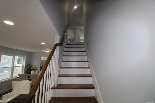 staircase featuring hardwood / wood-style floors