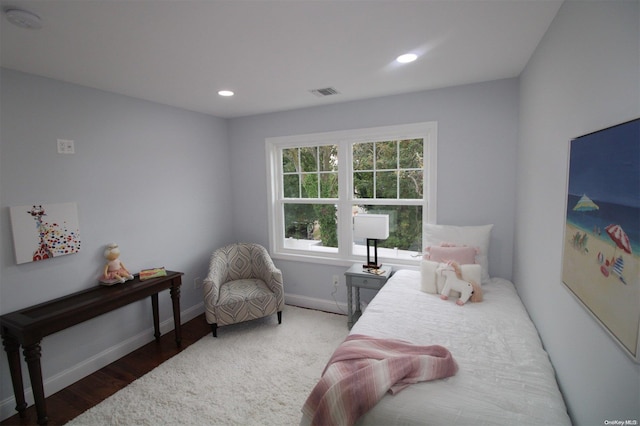 bedroom with hardwood / wood-style floors