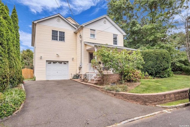 front facade featuring a front yard and a garage