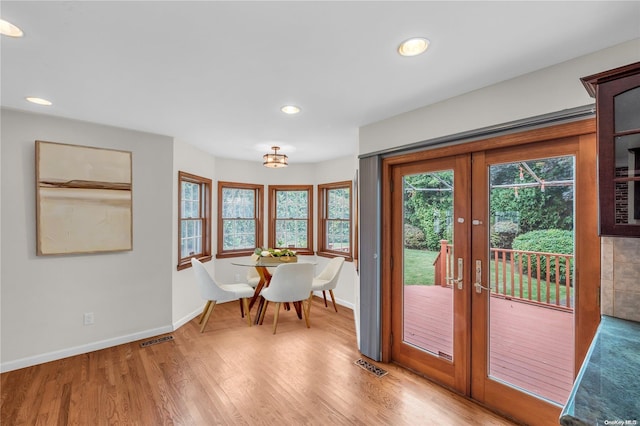 doorway featuring french doors and light wood-type flooring