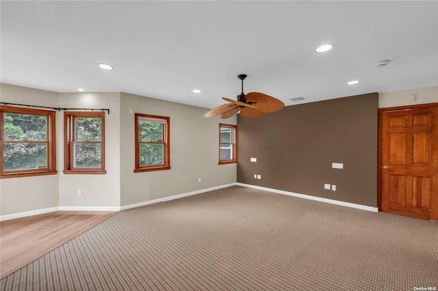 spare room with ceiling fan and carpet flooring