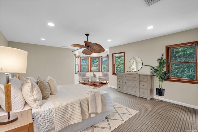 bedroom with light colored carpet and ceiling fan