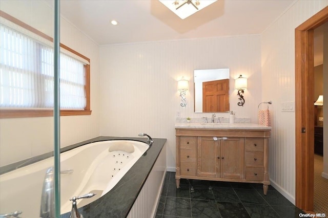 bathroom featuring vanity, tile patterned floors, ornamental molding, and a relaxing tiled tub