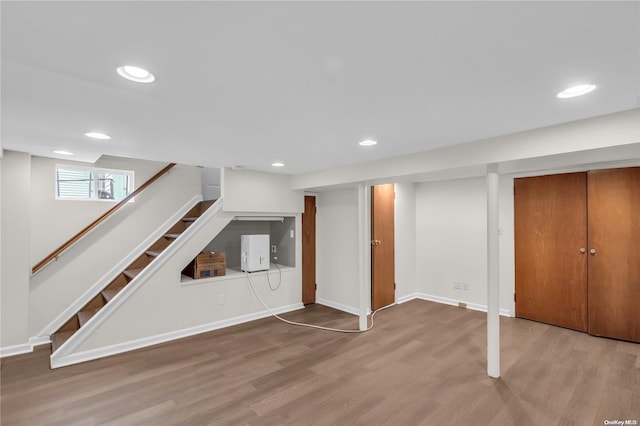 basement featuring light hardwood / wood-style floors