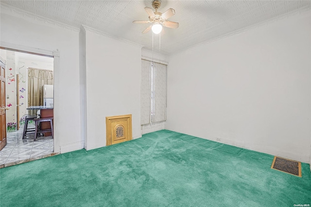 carpeted empty room with ceiling fan