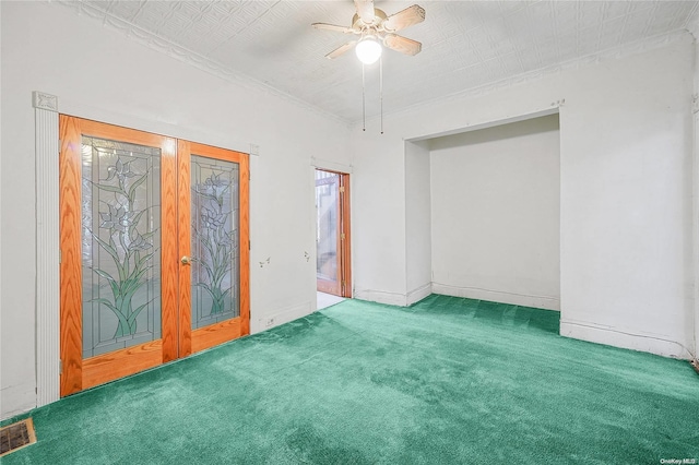 carpeted spare room with ceiling fan and a textured ceiling