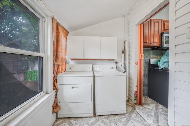 washroom with cabinets and independent washer and dryer