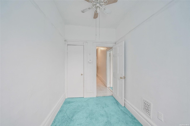 carpeted empty room with ceiling fan