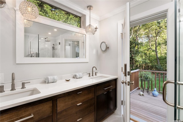 bathroom with hardwood / wood-style floors, vanity, walk in shower, and ornamental molding