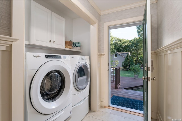 laundry area with washer and dryer and light tile patterned flooring