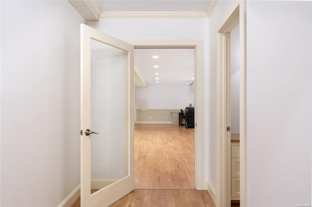 hall featuring ornamental molding and light wood-type flooring