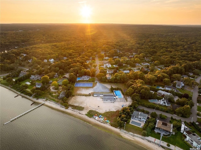 aerial view at dusk with a water view