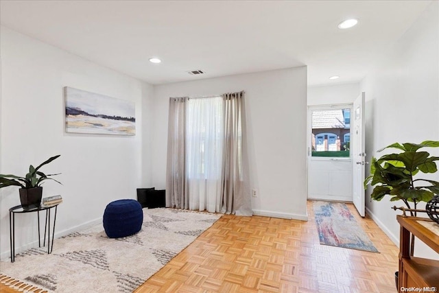 sitting room featuring light parquet floors