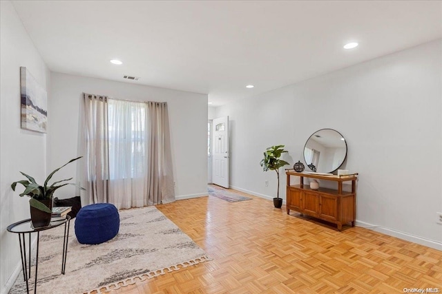 entryway with light parquet flooring