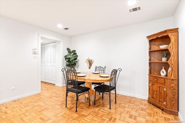 dining area with light parquet flooring