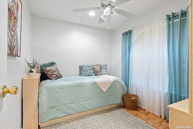 bedroom featuring ceiling fan and light parquet flooring