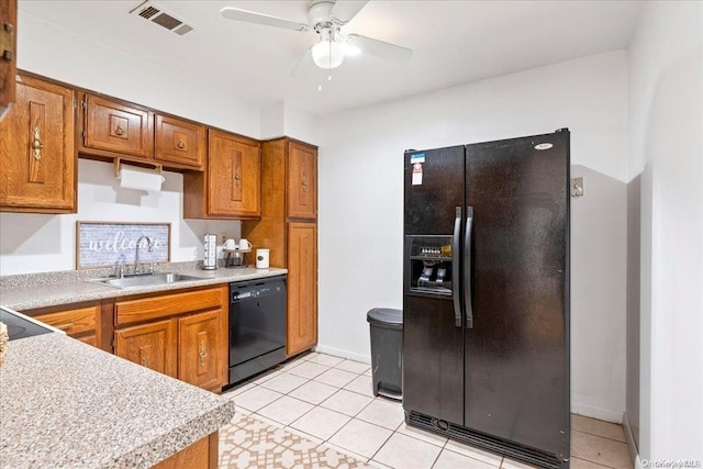 kitchen with black appliances, ceiling fan, light tile patterned flooring, and sink