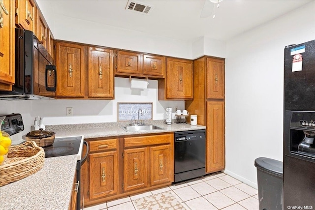 kitchen featuring black appliances, ceiling fan, light tile patterned floors, and sink