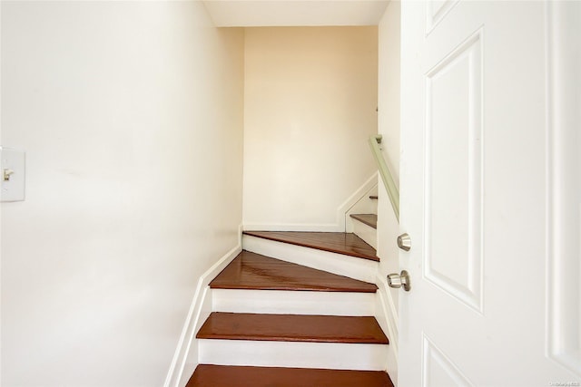 stairway featuring hardwood / wood-style flooring