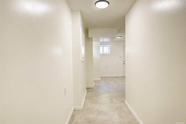 hallway featuring light tile patterned floors