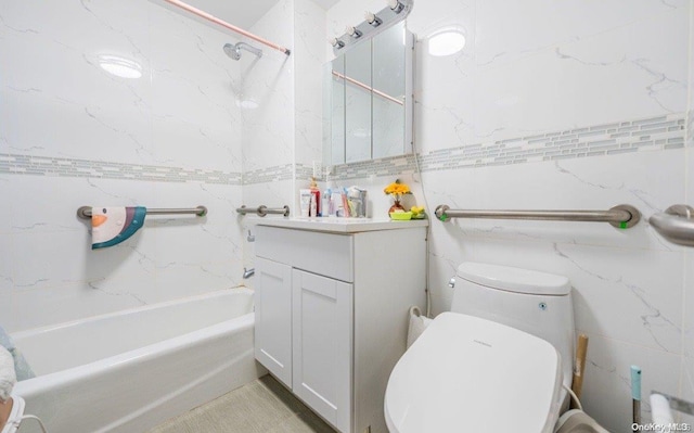 full bathroom featuring toilet, vanity, tiled shower / bath combo, and tile walls