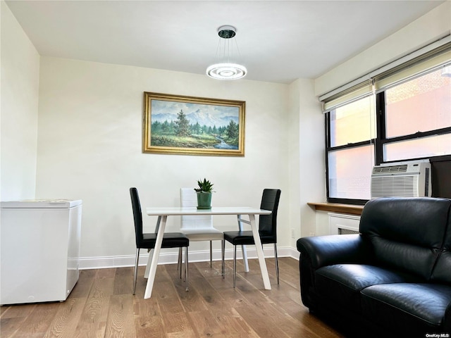 dining room with wood-type flooring