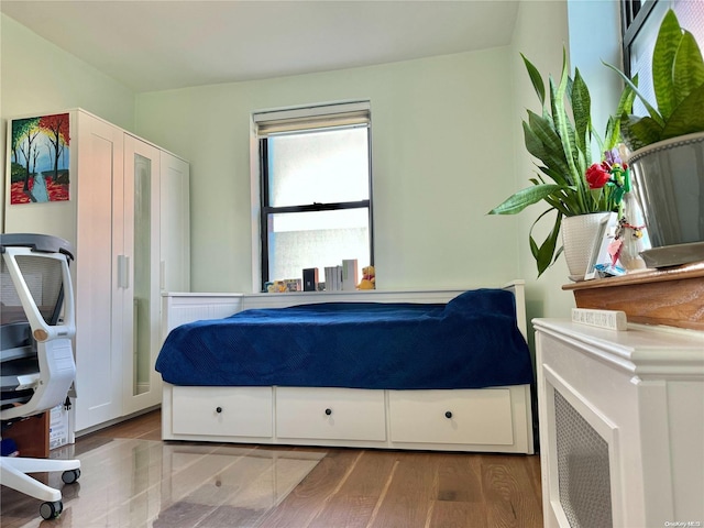 bedroom with light hardwood / wood-style flooring