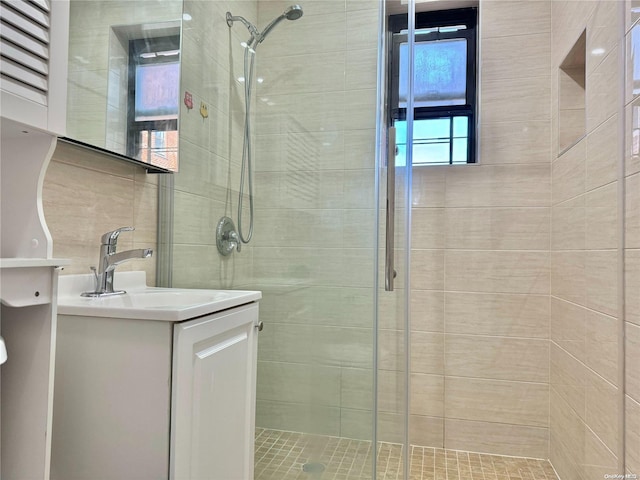 bathroom with vanity and an enclosed shower