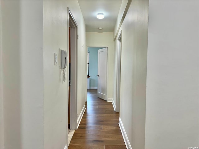 hall with dark hardwood / wood-style floors